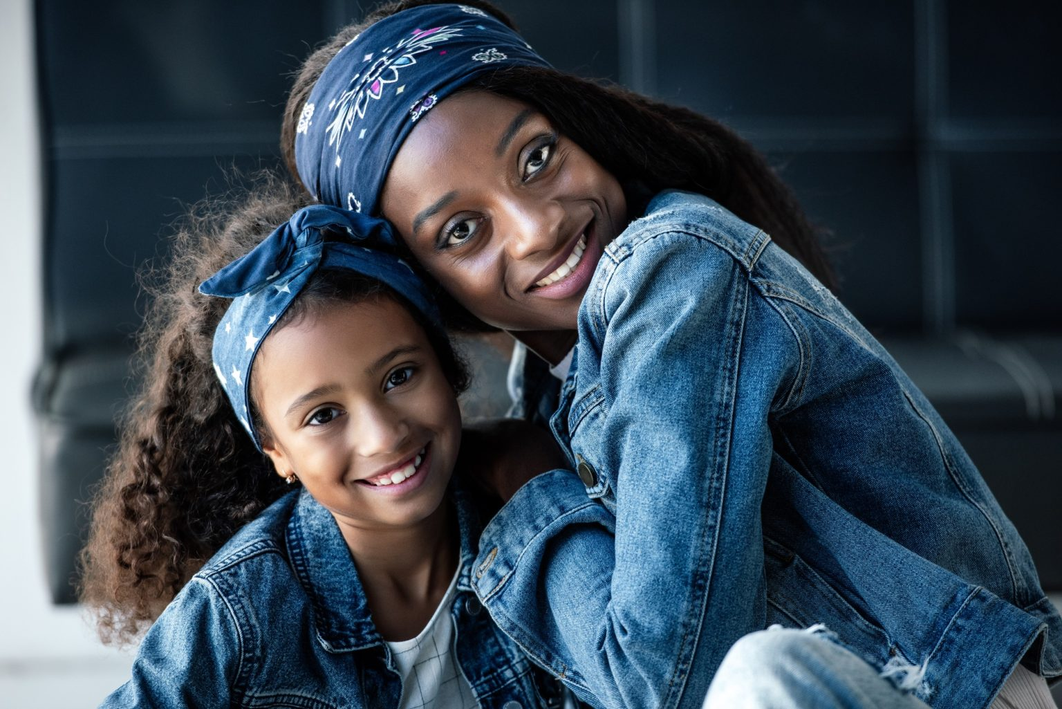 Mother and daughter smiling together